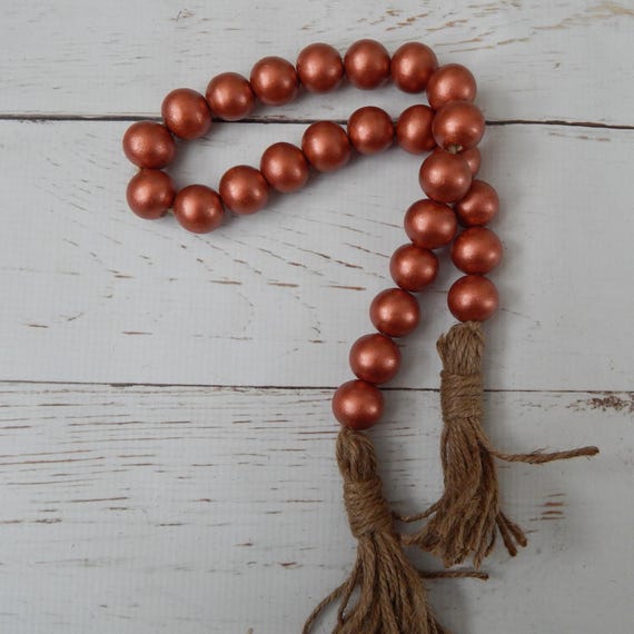 Metallic rust wood bead garland with beige jute tassels, boho home decor, farmhouse beads