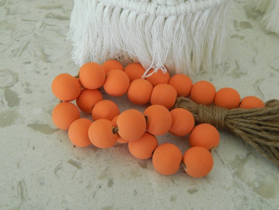 Orange persimmon wood bead garland with jute tassels, boho home decor, jewelry for the home, rustic bead garland, farmhouse beads