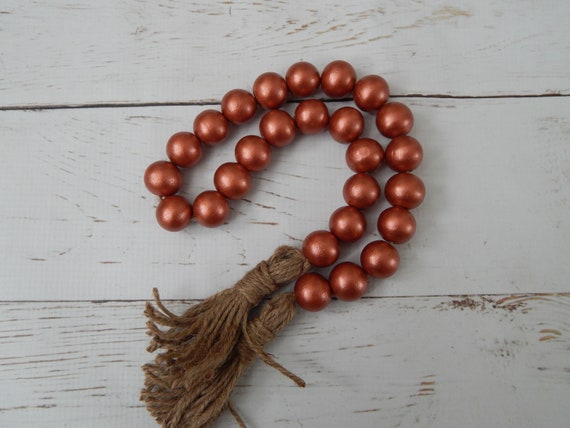 Metallic rust wood bead garland with beige jute tassels, boho home decor, farmhouse beads