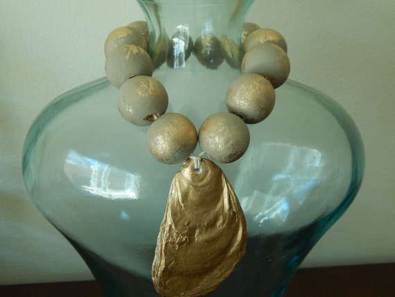 Oyster shell with wood beads, oyster shell decor, taupe and gold wood beads, beach house decor