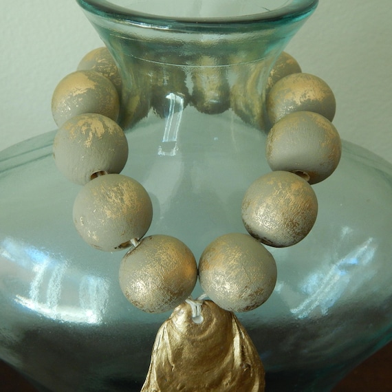Oyster shell with wood beads, oyster shell decor, taupe and gold wood beads, beach house decor