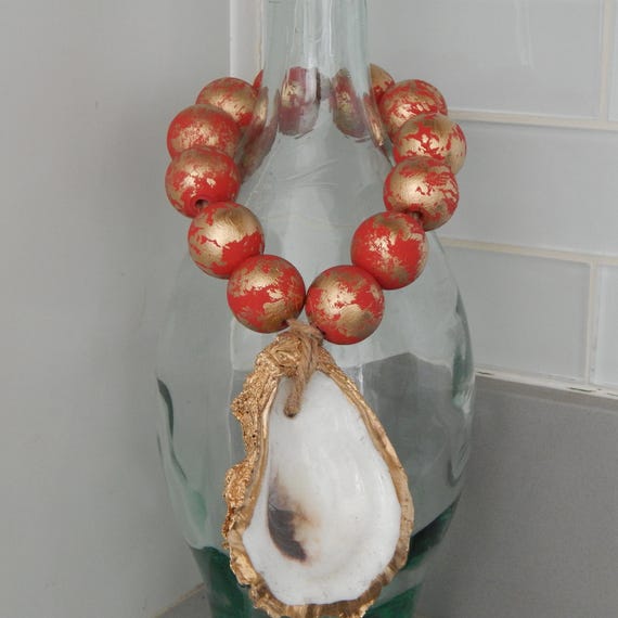 Gold oyster shell with wood beads, shell decor, welcome beads, coastal decor, wood loop garland, red and gold