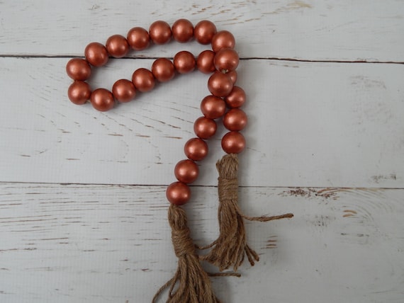 Metallic rust wood bead garland with beige jute tassels, boho home decor, farmhouse beads