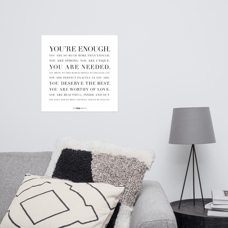 May include: Black and white typography print with the text "You're Enough." The text is in a bold, sans-serif font and is centered on the page. The print is a motivational quote about self-love and acceptance.