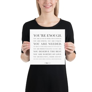 May include: A black and white motivational poster with the text "You're Enough." The poster includes a list of positive affirmations about self-worth and self-love.
