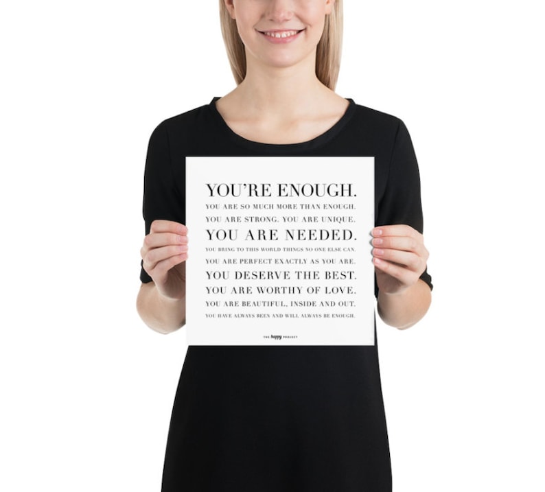 May include: A black and white motivational poster with the text "You're Enough." The poster includes a list of positive affirmations about self-worth and self-love.