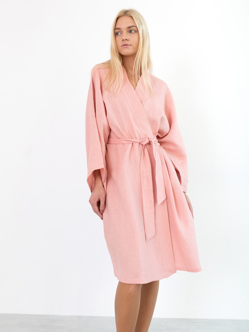 LUNA pink linen kimono robe, front view with hands in the side pockets.