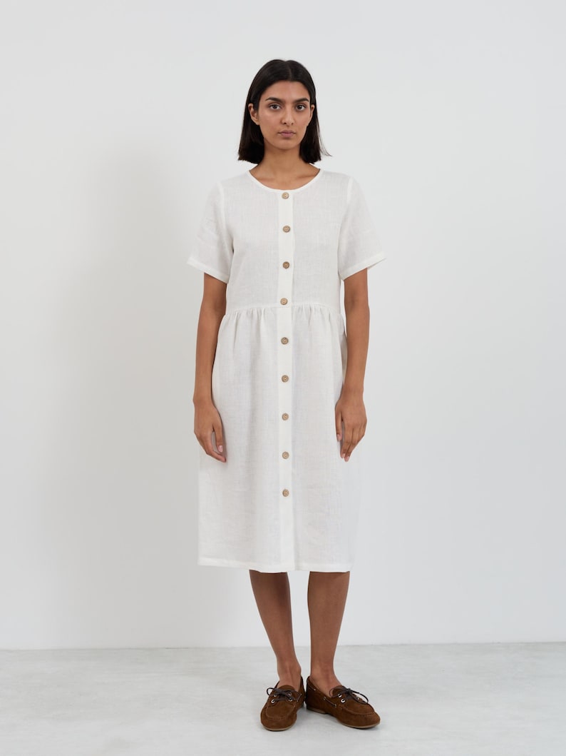 Full-length front view of the DOVE Ivory linen midi dress showing the complete button-front closure from neckline to hem with wooden buttons