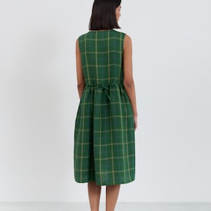 Full-length back view of the FERN Green Check linen midi dress showing the back tie at the gathered waist and clean sleeveless silhouette