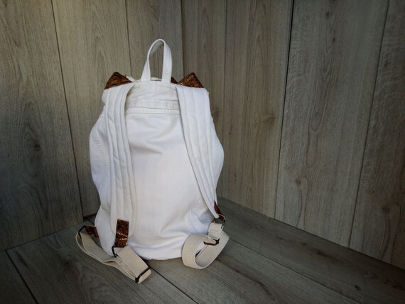 white denim backpack