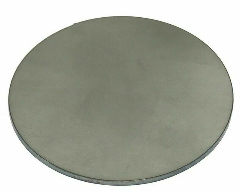 May include: A round, silver-colored metal disc.