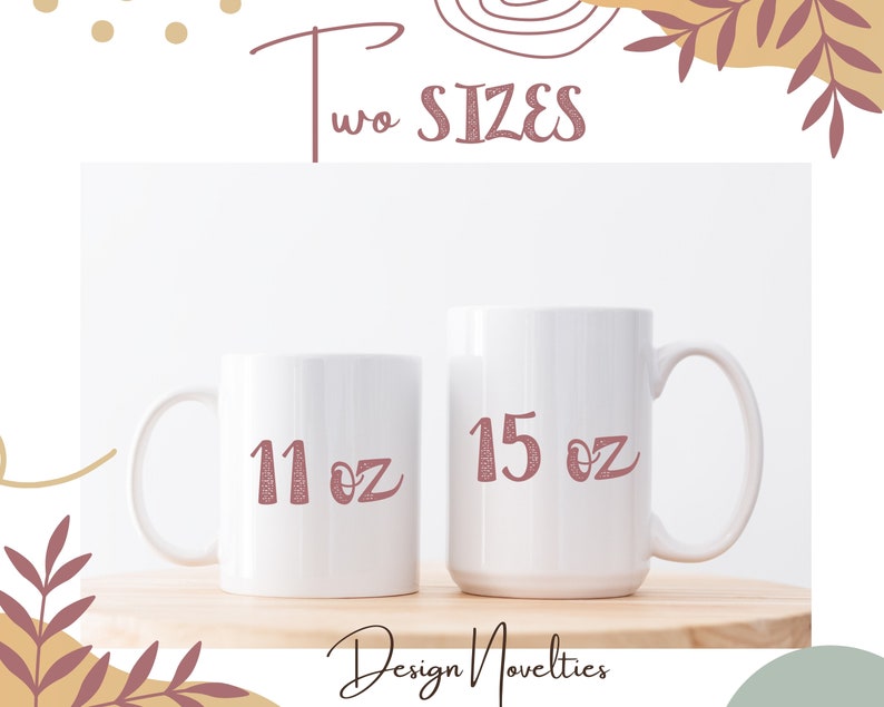 two white coffee mugs with red numbers on them