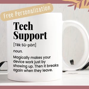 May include: White ceramic mug with a black design that says "Tech Support" with a definition of the word. The mug has a black handle.