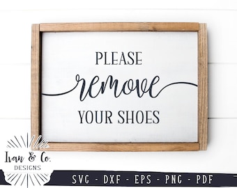 May include: A rectangular wooden sign with a white background and a brown wooden frame. The sign reads "PLEASE remove YOUR SHOES" in black script. The bottom of the sign has the text "SVG - DXF - EPS - PNG - PDF".
