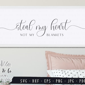 May include: White framed sign with black calligraphy that reads "steal my heart not my blankets".