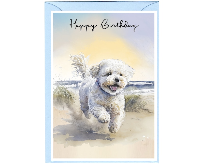 May include: A birthday card with a white dog running on a beach. The dog is facing the viewer and has its tongue out. The background is a watercolor painting of a beach with blue water and a yellow sky. The text 'Happy Birthday' is written in black cursive at the top of the card.