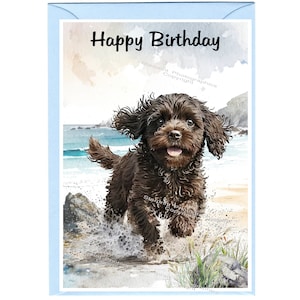 May include: Happy Birthday card featuring a watercolor illustration of a brown puppy running on a beach with waves crashing behind it.