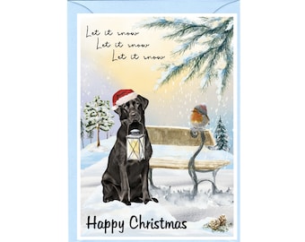 Puede incluir: Un labrador retriever negro con un gorro de Papá Noel está sentado en un banco nevado sosteniendo una linterna. Un petirrojo con un gorro rojo está sentado en el banco detrás del perro. El texto "Let it snow" se repite tres veces y el texto "Happy Christmas" está en la parte inferior de la imagen.