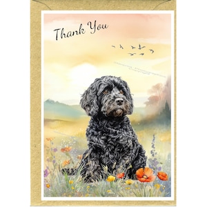 May include: A greeting card with a watercolour illustration of a black dog in a field of flowers. The words "Thank You" are written at the top. The background depicts a sunset and flying birds.