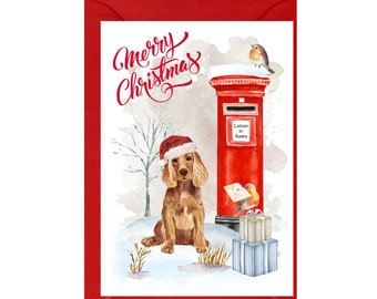 May include: A watercolor Christmas card featuring a brown and white cocker spaniel wearing a Santa hat, standing in front of a red mailbox with the words "Letters to Santa" on it. Two robins are perched on the mailbox and a snowy landscape is in the background.