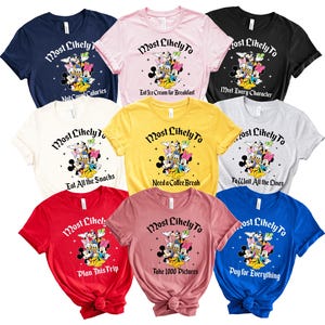 May include: A collection of colorful t-shirts featuring a cartoon graphic of Mickey Mouse, Minnie Mouse, Donald Duck, and Daisy Duck. Each shirt has the phrase "Most Likely To" followed by a different activity, such as "Eat All the Snacks."
