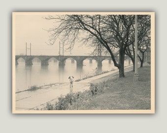 Man with Umbrella walking along the Susquehanna River in rainy Harrisburg Pennsylvania - 5x7 Black and White Darkroom Print - Cream Toned