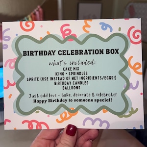 May include: A birthday celebration box with a white background and colorful confetti-like designs. The box includes cake mix, icing, sprinkles, Sprite, birthday candles, and balloons. Text on the box reads "Birthday Celebration Box" and "Happy Birthday to someone special!"