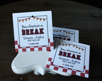 May include: White square cards with red checkered borders and the text "You deserve a BREAK. Dinner + dishes are on us! Love, Levi" are displayed on a white ceramic dish. Pizza slice banner decorates the top.