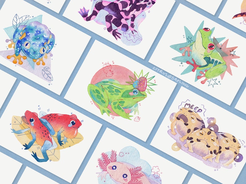 May include: A set of nine watercolor illustrations featuring different types of frogs. The illustrations are on white paper with a light blue background. The frogs are depicted in various poses and with different expressions. Some of the frogs are wearing hats or other accessories. The illustrations are all in a whimsical style.