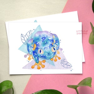 May include: A watercolor illustration of a blue and purple frog with orange feet and white spots. The frog is sitting on a purple and blue geometric background with leaves.