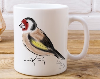 Taza de pájaro jilguero de la artista Susy Fuentes