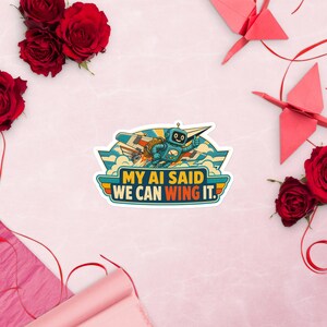 May include: A die-cut sticker featuring a blue robot flying a paper airplane through clouds. The text reads, "MY AI SAID WE CAN WING IT." The design uses a retro color palette of orange, yellow, and teal, with a white border surrounding the illustration.