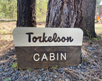 Letrero personalizado para cabaña en sendero del Parque Nacional