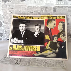 May include: A vintage movie poster for the Spanish-language film "Los Hijos del Divorcio" (The Children of Divorce). The poster features a black and white photo of the actors Yolanda Varela, Amparo Rivelles, and Enrique Rambal. The poster is in Spanish and features the title of the film in large, bold letters.