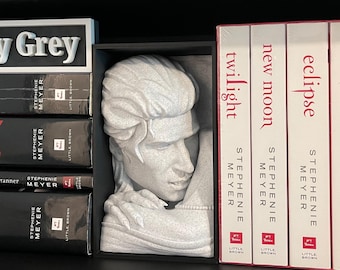 May include: A set of five paperback books with red and white covers. The books are titled "Twilight", "New Moon", "Eclipse", "Breaking Dawn", and "Midnight Sun". The books are by author Stephenie Meyer. The books are on a bookshelf with other books.