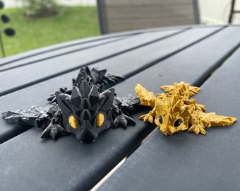 Mini dragons articulés imprimés en 3D noir et or