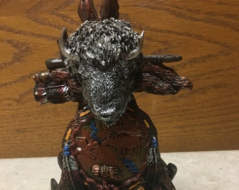 Buffalo head with skulls figurine