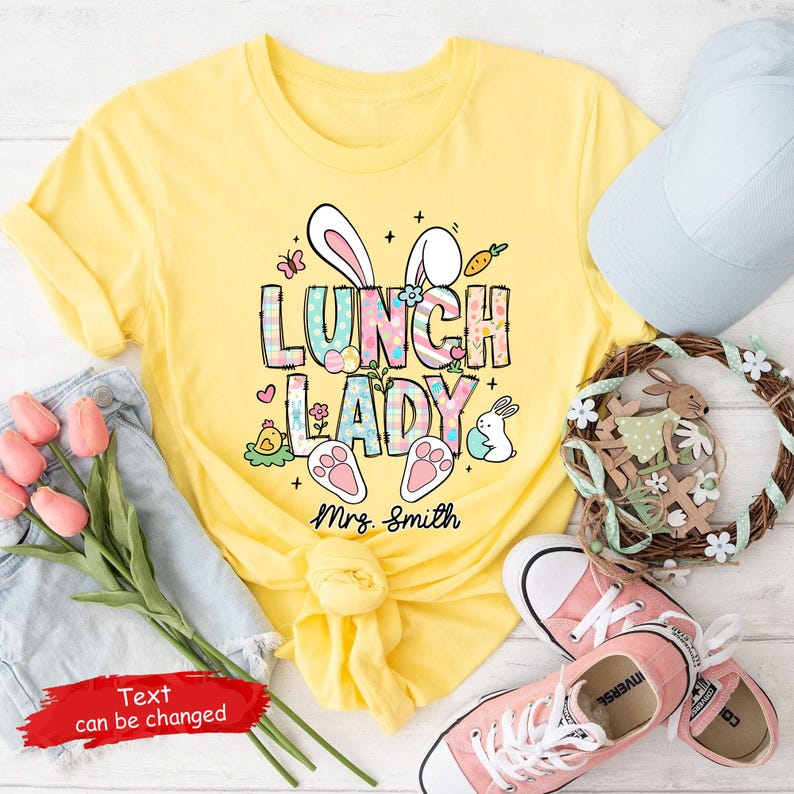 May include: Yellow t-shirt with a graphic of bunny ears and the text "Lunch Lady" with a personalized name "Mrs. Smith".