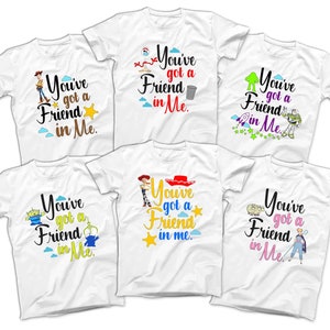 May include: Six white t-shirts with different Toy Story characters and the text "You've got a Friend in Me."