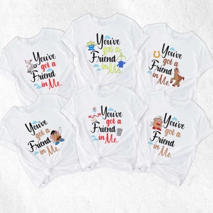 May include: Six white t-shirts with different Toy Story characters and the text "You've got a Friend in Me."