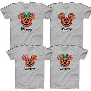 May include: Four gray t-shirts with a pumpkin-faced Mickey Mouse design. The shirts say "Mommy", "Daddy", and "Custom" on them.