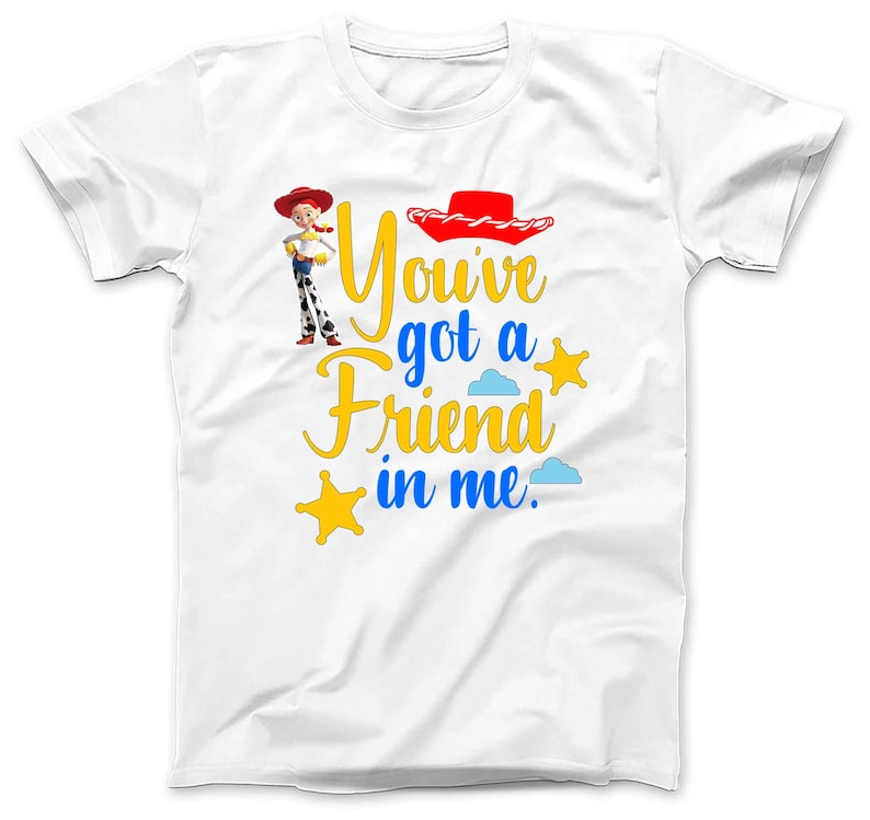 May include: White t-shirt with a cartoon image of Woody from Toy Story. The shirt has the text "You've got a friend in me." in blue and yellow lettering.