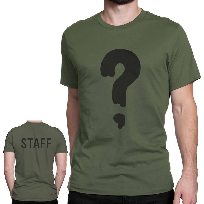 May include: A green t-shirt with a black question mark graphic. The back of the shirt says "STAFF" in black text.
