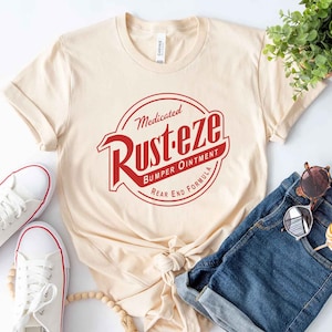 Rust-eze logo T-shirt Cars Rusteze Bumper Ointment Radiator Springs  Disneyland, WDW Family Shirts, Adult, Kids, Toddler, Baby sizes
