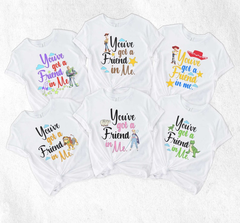 May include: Five white t-shirts with different Toy Story characters and the text "You've got a Friend in Me."