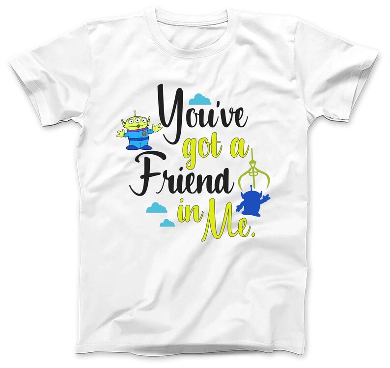 May include: White t-shirt with a green alien character and the text "You've got a friend in me."