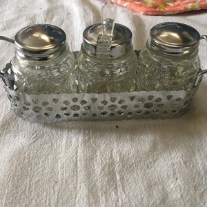 Vintage Glass and Chrome Salt and Pepper 1980s Salt Pepper and Sugar Set of 3 with spoon Ornate metal holder with handles made in Hong Kong