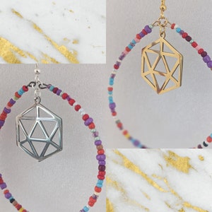 May include: A pair of hoop earrings with a geometric design pendant. The hoops are made of colorful beads in shades of red, pink, purple, blue, and white.