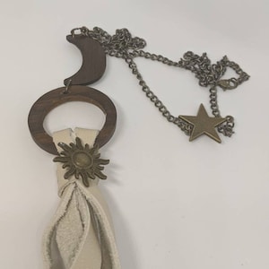 Genuine leather and wooden bronze sun moon and star tassel necklace, leather tassels wooden hoop. Long tassels celestial theme