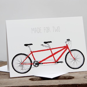 Vélo tandem fait pour deux cartes